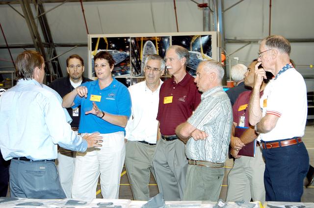 NASA image: KENNEDY SPACE CENTER, FLA.  - In the Columbia Debris Hangar, Shuttle Launch Director Mike Leinbach answers questions from the Stafford-Covey Return to Flight Task Group (SCTG).  Chairing the task group are Richard O. Covey (fifth from left), former Space Shuttle commander, and Thomas P. Stafford, Apollo commander.  Chartered by NASA Administrator Sean O’Keefe, the task group will perform an independent assessment of NASA’s implementation of the final recommendations by the Columbia Accident Investigation Board.