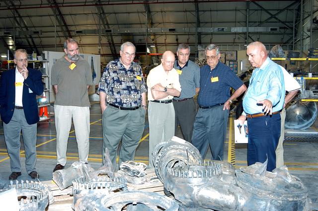 NASA image: KENNEDY SPACE CENTER, FLA.  -  In the Columbia Debris Hangar, members of the  Stafford-Covey Return to Flight Task Group (SCTG) inspect some of the debris.   Chairing the task group are Richard O. Covey, former Space Shuttle commander, and Thomas P. Stafford (fourth from left), Apollo commander.  Chartered by NASA Administrator Sean O’Keefe, the task group will perform an independent assessment of NASA’s implementation of the final recommendations by the Columbia Accident Investigation Board.