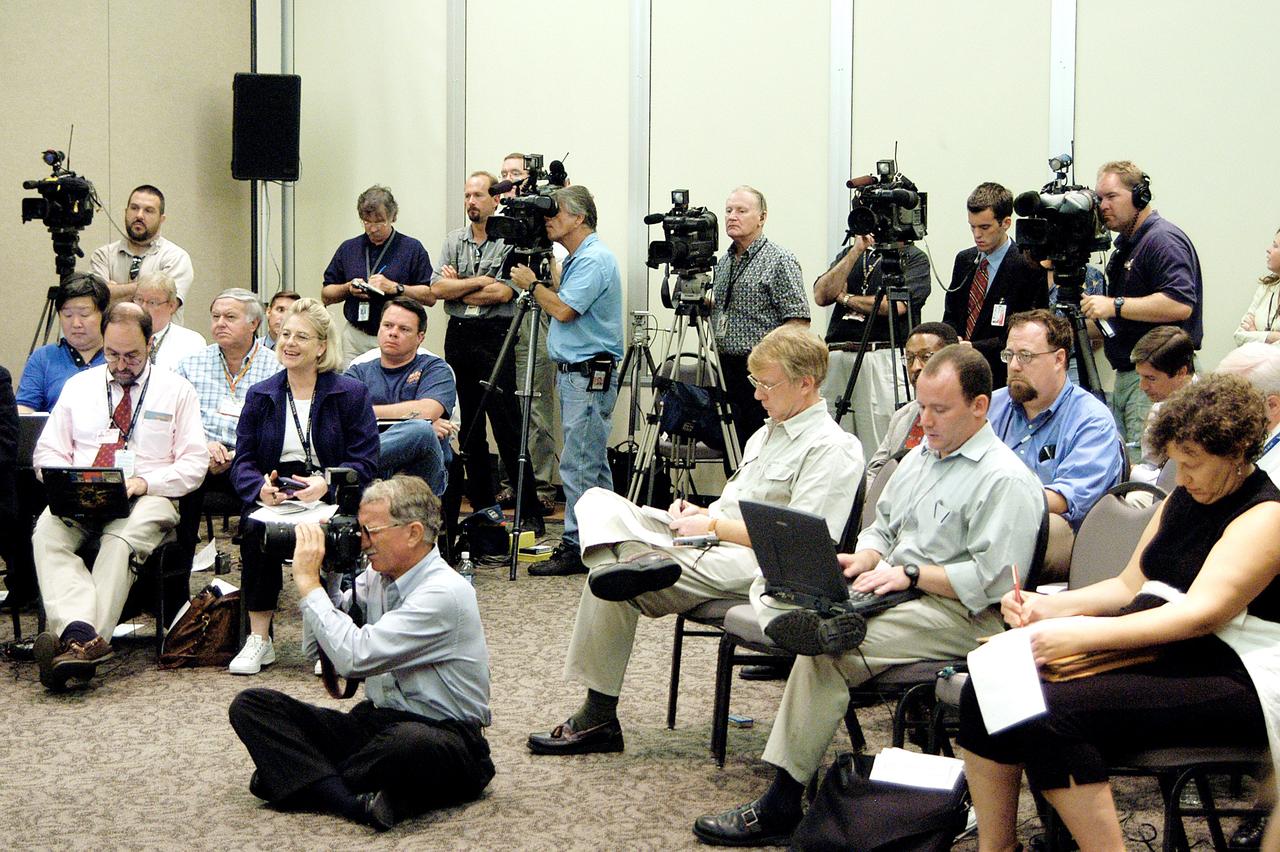 KENNEDY SPACE CENTER, FLA.  -  The news media capture the words and images of the Return To Flight Task Group (RTFTG) which held its first public meeting at the Debus Center, KSC Visitor Complex.  The group is co-chaired by former Shuttle commander Richard O. Covey and retired Air Force Lt. Gen. Thomas P. Stafford, who was an Apollo commander. The RTFTG was at KSC to conduct organizational activities, tour Space Shuttle facilities and receive briefings on Shuttle-related topics.  The task group was chartered by NASA Administrator Sean O’Keefe to perform an independent assessment of NASA’s implementation of the final recommendations of the Columbia Accident Investigation Board.