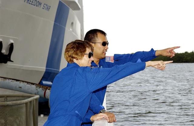 NASA image: KENNEDY SPACE CENTER, FLA. -   While touring the SRB Retrieval Ship Freedom Star, STS-114 Commander Eileen Collins and Mission Specialist Soichi Noguchi point at something on the Banana River. Noguchi is with the Japanese space agency NASDA.  The ships routinely are docked at Hangar AF on the river.  On their mission, the crew - which also includes Pilot James Kelly and Mission Specialist Stephen Robinson - will carry the MultiPurpose Logistics Module (MPLM) Raffaello and External Stowage Platform 2 to the International Space Station.  The MPLM will contain supplies and equipment.  Another goal of the mission is to remove and replace a Control Moment Gyro.  Launch date for mission STS-114 is under review.