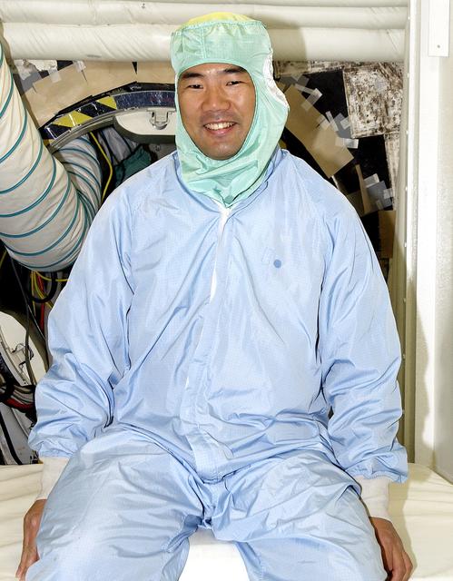 NASA image: KENNEDY SPACE CENTER, FLA. -  Sitting in the entry hatch to orbiter Atlantis is STS-114 Mission Specialist Soichi Noguchi, who is with the Japanese space agency NASDA. He and other crew members - Commander Eileen Collins, Pilot James Kelly and Mission Specialist Stephen Robinson - are at KSC for equipment familiarization. Mission STS-114 will carry the MultiPurpose Logistics Module (MPLM) Raffaello and External Stowage Platform 2 to the International Space Station.  The MPLM will contain supplies and equipment.  Another goal of the mission is to remove and replace a Control Moment Gyro.  Launch date for mission STS-114 is under review.