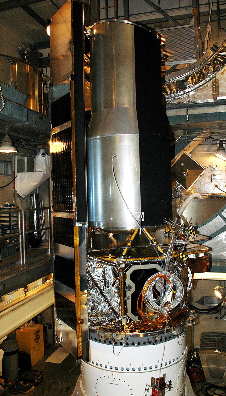 KENNEDY SPACE CENTER, FLA.  - In the mobile service tower on Launch Pad 17-B, Cape Canaveral Air Force Station, the Space Infrared Telescope Facility (SIRTF) waits for encapsulation. SIRTF will obtain images and spectra by detecting the infrared energy, or heat, radiated by objects in space. Consisting of a 0.85-meter telescope and three cryogenically cooled science instruments, SIRTF will be the largest infrared telescope ever launched into space. It is the fourth and final element in NASA’s family of orbiting “Great Observatories.” Its highly sensitive instruments will give a unique view of the Universe and peer into regions of space that are hidden from optical telescopes.