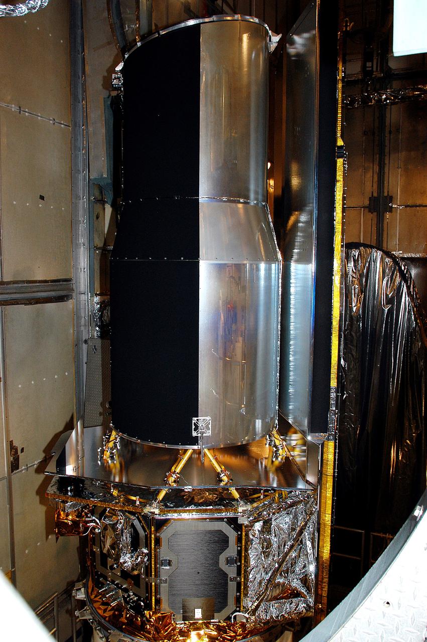 KENNEDY SPACE CENTER, FLA.  - In the mobile service tower on Launch Pad 17-B, Cape Canaveral Air Force Station, the Space Infrared Telescope Facility (SIRTF) waits for encapsulation. SIRTF will obtain images and spectra by detecting the infrared energy, or heat, radiated by objects in space. Consisting of a 0.85-meter telescope and three cryogenically cooled science instruments, SIRTF will be the largest infrared telescope ever launched into space. It is the fourth and final element in NASA’s family of orbiting “Great Observatories.” Its highly sensitive instruments will give a unique view of the Universe and peer into regions of space that are hidden from optical telescopes.