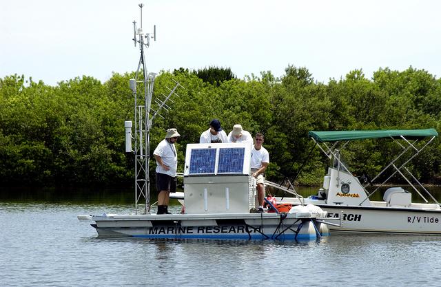 NASA image: KENNEDY SPACE CENTER, FLA.  -  Researchers conduct underwater acoustic research in the Launch Complex 39 turn basin.  Several government agencies, including NASA, NOAA, the Navy, the Coast Guard, and the Florida Fish and Wildlife Commission are involved in the testing. The research involves demonstrations of passive and active sensor technologies, with applications in fields ranging from marine biological research to homeland security. The work is also serving as a pilot project to assess the cooperation between the agencies involved. Equipment under development includes a passive acoustic monitor developed by NASA’s Jet Propulsion Laboratory, and mobile robotic sensors from the Navy’s Mobile Diving and Salvage Unit.