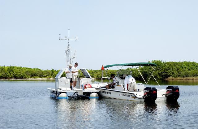 NASA image: KENNEDY SPACE CENTER, FLA.  -  Researchers utilize several types of watercraft to conduct underwater acoustic research in the Launch Complex 39 turn basin.  Several government agencies, including NASA, NOAA, the Navy, the Coast Guard, and the Florida Fish and Wildlife Commission are involved in the testing. The research involves demonstrations of passive and active sensor technologies, with applications in fields ranging from marine biological research to homeland security. The work is also serving as a pilot project to assess the cooperation between the agencies involved. Equipment under development includes a passive acoustic monitor developed by NASA’s Jet Propulsion Laboratory, and mobile robotic sensors from the Navy’s Mobile Diving and Salvage Unit.