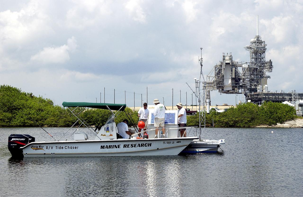 KENNEDY SPACE CENTER, FLA.  -  Researchers utilize several types of watercraft to conduct underwater acoustic research in the Launch Complex 39 turn basin near Launch Pad 39A.  Several government agencies, including NASA, NOAA, the Navy, the Coast Guard, and the Florida Fish and Wildlife Commission are involved in the testing. The research involves demonstrations of passive and active sensor technologies, with applications in fields ranging from marine biological research to homeland security. The work is also serving as a pilot project to assess the cooperation between the agencies involved. Equipment under development includes a passive acoustic monitor developed by NASA’s Jet Propulsion Laboratory, and mobile robotic sensors from the Navy’s Mobile Diving and Salvage Unit.