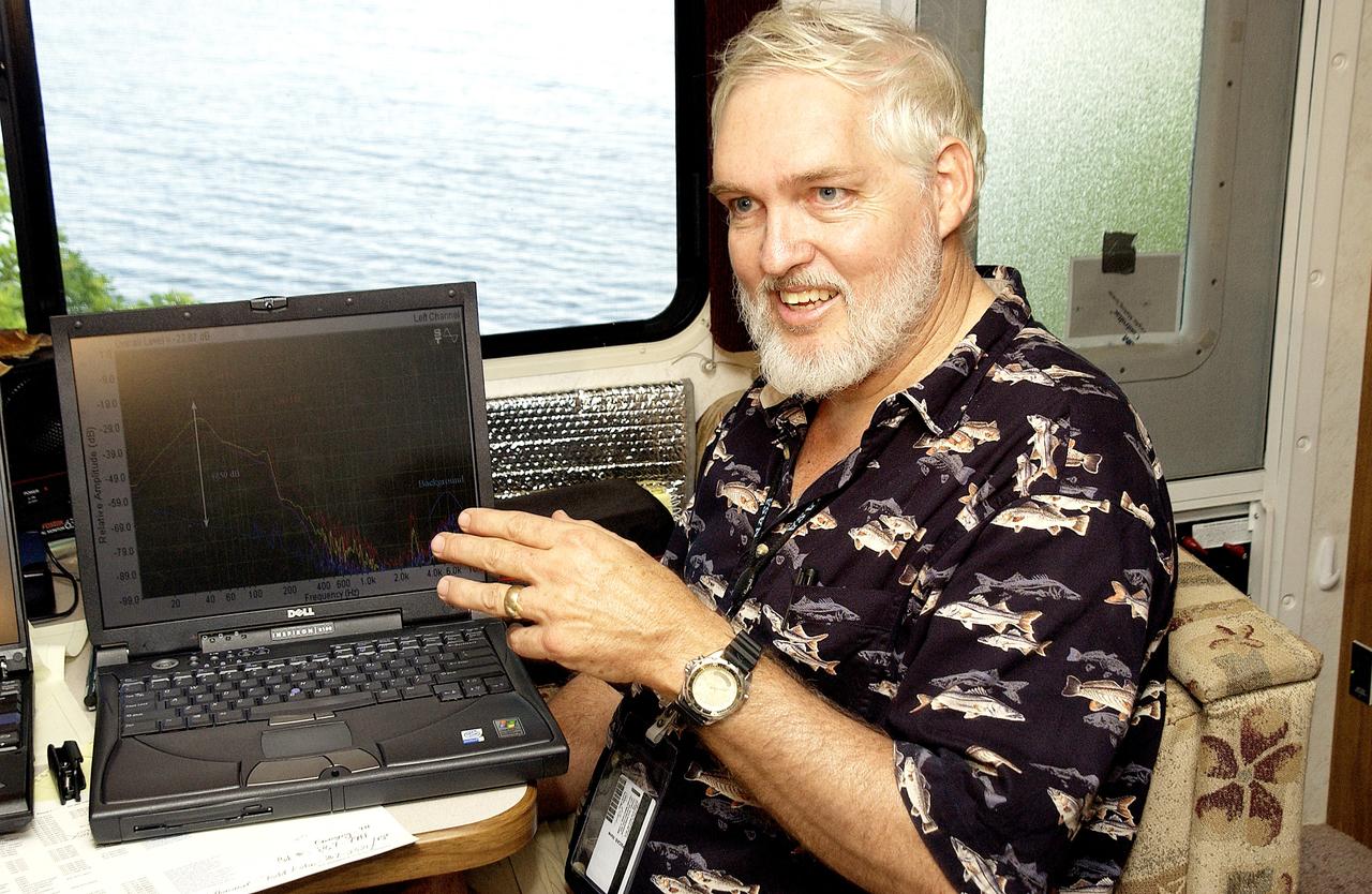 KENNEDY SPACE CENTER, FLA.  -  Dr. Grant Gilmore, Dynamac Corp., utilizes a laptop computer to explain aspects of the underwater acoustic research under way in the Launch Complex 39 turn basin.  Several government agencies, including NASA, NOAA, the Navy, the Coast Guard, and the Florida Fish and Wildlife Commission are involved in the testing. The research involves demonstrations of passive and active sensor technologies, with applications in fields ranging from marine biological research to homeland security. The work is also serving as a pilot project to assess the cooperation between the agencies involved. Equipment under development includes a passive acoustic monitor developed by NASA’s Jet Propulsion Laboratory, and mobile robotic sensors from the Navy’s Mobile Diving and Salvage Unit.