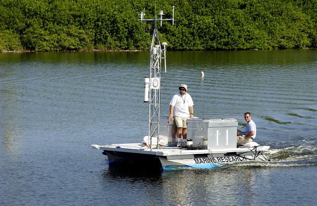 NASA image: KENNEDY SPACE CENTER, FLA.  -  Researchers are positioned on one of the watercraft being utilized to conduct underwater acoustic research in the Launch Complex 39 turn basin.  Several government agencies, including NASA, NOAA, the Navy, the Coast Guard, and the Florida Fish and Wildlife Commission are involved in the testing. The research involves demonstrations of passive and active sensor technologies, with applications in fields ranging from marine biological research to homeland security. The work is also serving as a pilot project to assess the cooperation between the agencies involved. Equipment under development includes a passive acoustic monitor developed by NASA’s Jet Propulsion Laboratory, and mobile robotic sensors from the Navy’s Mobile Diving and Salvage Unit.