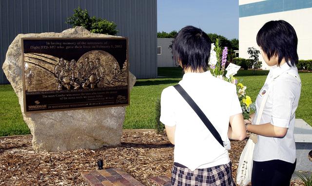 NASA image: KENNEDY SPACE CENTER, FLA.  -     Japanese girls from Urawa Daiichi Girls High School, Urawa, Japan, carry a floral tribute to the crew of Columbia to place at the STS-107 memorial stone at the Spacehab facility, Cape Canaveral, Fla.   The group was  awarded the trip to Florida when their experiments were chosen to fly on mission STS-107.  The group was also meeting with American students from Melbourne and Jacksonville, Fla.   The National Space Development  Agency of Japan (NASDA) and the KSC International Space Station and Payloads Processing Directorate worked with the NASA KSC Education Programs and University Research Division to coordinate the students’ visit.