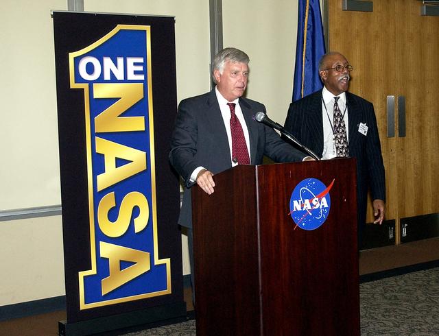 NASA image: KENNEDY SPACE CENTER, FLA.  -   KSC Director Jim Kennedy and Glenn Research Center Director Dr. Julian Earls share the stage during the rollout of the One NASA initiative at KSC.  Earls gave a motivational speech during the luncheon held at the Visitor Complex Debus Conference Center.  The event was held at the IMAX Theater® where NASA leaders discussed One NASA with selected employees.   Explaining how their respective centers contribute to One NASA, along with Kennedy and Earls, were James Jennings,  NASA’s associate deputy administrator for institutions and asset management; Ed Weiler, associate administrator for Space Science; Kevin Peterson, Dryden Flight Research Center director; incoming KSC Deputy Director Woodrow Whitlow; and implementation team lead Johnny Stevenson.