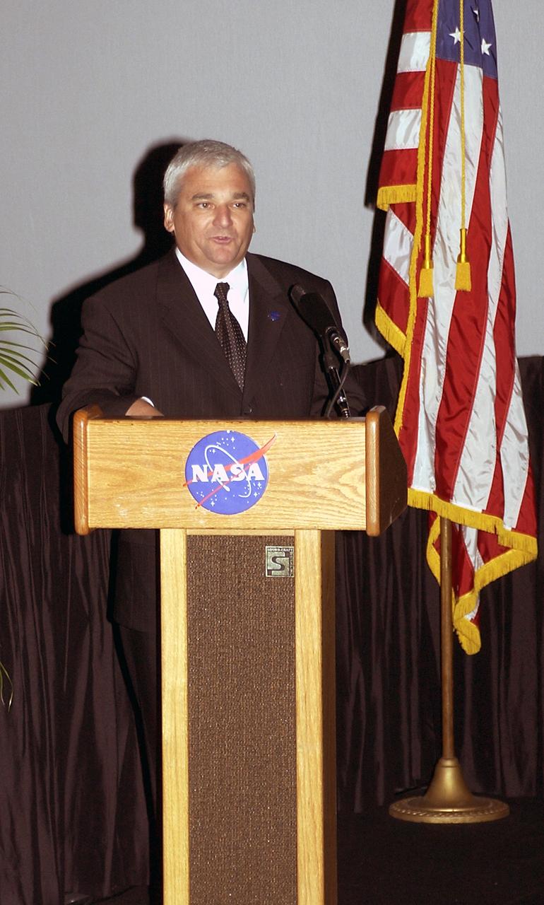 KENNEDY SPACE CENTER, FLA.  -  Dryden Flight Research Center Director Kevin Peterson talks about One NASA during the rollout of the Agency initiative at KSC.  The event was held at the IMAX Theater® where NASA leaders discussed One NASA with selected employees.  Explaining how their respective centers contribute to One NASA, along with Peterson, were KSC Director Jim Kennedy, James Jennings,  NASA’s associate deputy administrator for institutions and asset management; Ed Weiler, associate administrator for Space Science; Kevin Peterson, Dryden Flight Research Center director; incoming KSC Deputy Director Woodrow Whitlow; and implementation team lead Johnny Stevenson.   Glenn Research Center Director Dr. Julian Earls gave a motivational speech during the luncheon held at the Visitor Complex Debus Conference Center.