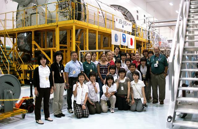 NASA image: KENNEDY SPACE CENTER, FLA. -   Japanese girls from Urawa Daiichi Girls High School, Urawa, Japan, pose for a group photo during a visit to the Space Station Processing Facility. They were awarded the trip to Kennedy Space Center when their experiments were chosen to fly on mission STS-107. The girls are accompanied by American students from Melbourne and Jacksonville, Fla.  The National Space Development Agency of Japan (NASDA) and the KSC International Space Station/Payload Processing Directorate worked with the NASA KSC Education Programs and University Research Division to coordinate the students’ visit.
