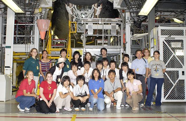NASA image: KENNEDY SPACE CENTER, FLA. -   Japanese girls from Urawa Daiichi Girls High School, Urawa, Japan, pose for a group photo during a visit to the Orbiter Processing Facility. They were awarded the trip to Kennedy Space Center when their experiments were chosen to fly on mission STS-107. The girls are accompanied by American students from Melbourne and Jacksonville, Fla.  The National Space Development Agency of Japan (NASDA) and the KSC International Space Station/Payload Processing Directorate worked with the NASA KSC Education Programs and University Research Division to coordinate the students’ visit.