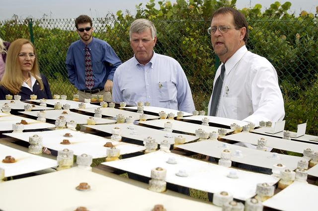 NASA image: KENNEDY SPACE CENTER, FLA. -   On a tour of the KSC Beach Corrosion Test Site, Center Director Jim Kennedy (second from right) learns from Testbed Manager Louis MacDowell (right) about a project being undertaken for the U.S. Navy.  Being studied are nonchrome primers for aircraft.  At left are Lead Scientist Dr. Luz Marina Calle and  Dr. Paul Hintze, who is working on a graduate project for the National Research Council.  The KSC Beach Corrosion Test Site was established in the 1960s and has provided more than 30 years of historical information on the long-term performance of many materials in use at KSC and other locations around the world. Located 100 feet from the Atlantic Ocean approximately 1 mile south of the Space Shuttle launch sites, the test facility includes an atmospheric exposure site, a flowing seawater exposure site, and an on-site electrochemistry laboratory and monitoring station. The beach laboratory is used to conduct real-time corrosion experiments and provides for the remote monitoring of surrounding weather conditions. The newly added flowing seawater immersion facility provides for the immersion testing of materials and devices under controlled conditions.