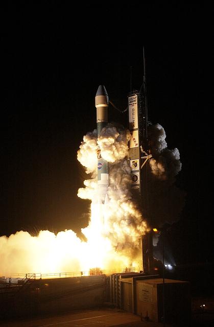 NASA image: KENNEDY SPACE CENTER, FLA.  -  NASA's Space Infrared Telescope Facility (SIRTF) lifts off from Launch Pad 17-B, Cape Canaveral Air Force Station, on Aug. 25 at 1:35:39 a.m. EDT. SIRTF will obtain images and spectra by detecting the infrared energy, or heat, radiated by objects in space. Consisting of a 0.85-meter telescope and three cryogenically cooled science instruments, SIRTF will be the largest infrared telescope ever launched into space. It is the fourth and final element in NASA’s family of orbiting “Great Observatories.” Its highly sensitive instruments will give a unique view of the Universe and peer into regions of space that are hidden from optical telescopes.