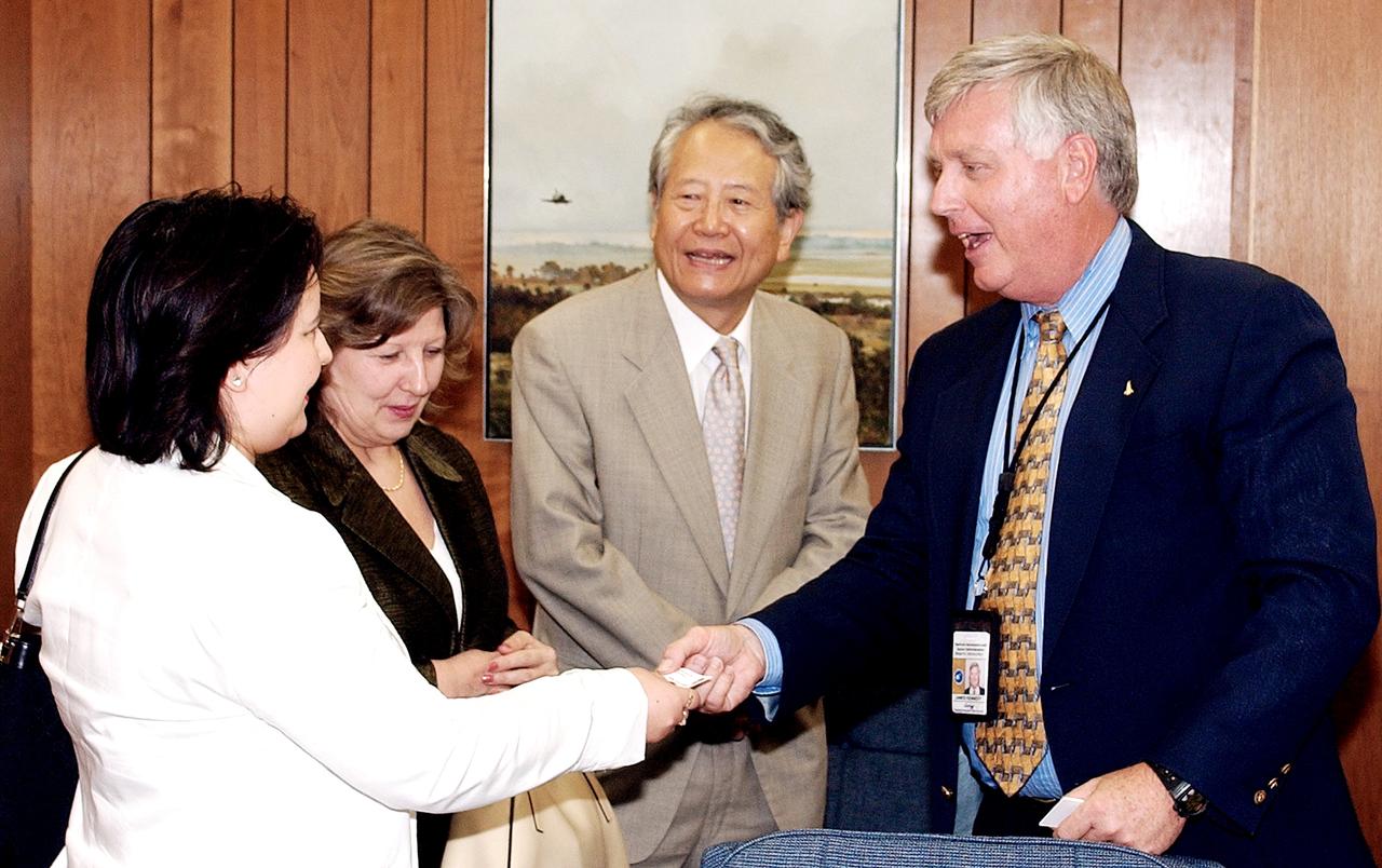 KENNEDY SPACE CENTER, FLA. - KSC Director James W. Kennedy receives Consul General of Japan Ko Kodaira and his family in his office in Headquarters Building during their visit to Kennedy Space Center (KSC). From left are Kodaira's daughter Reiko, his wife Marie, Kodaira, and Kennedy. Kodaira is touring the facilities at KSC at the invitation of the local office of the National Space Development Agency of Japan (NASDA) to acquaint him with KSC's unique processing capabilities.