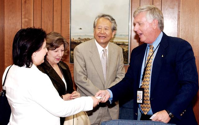 NASA image: KENNEDY SPACE CENTER, FLA. - KSC Director James W. Kennedy receives Consul General of Japan Ko Kodaira and his family in his office in Headquarters Building during their visit to Kennedy Space Center (KSC). From left are Kodaira's daughter Reiko, his wife Marie, Kodaira, and Kennedy. Kodaira is touring the facilities at KSC at the invitation of the local office of the National Space Development Agency of Japan (NASDA) to acquaint him with KSC's unique processing capabilities.