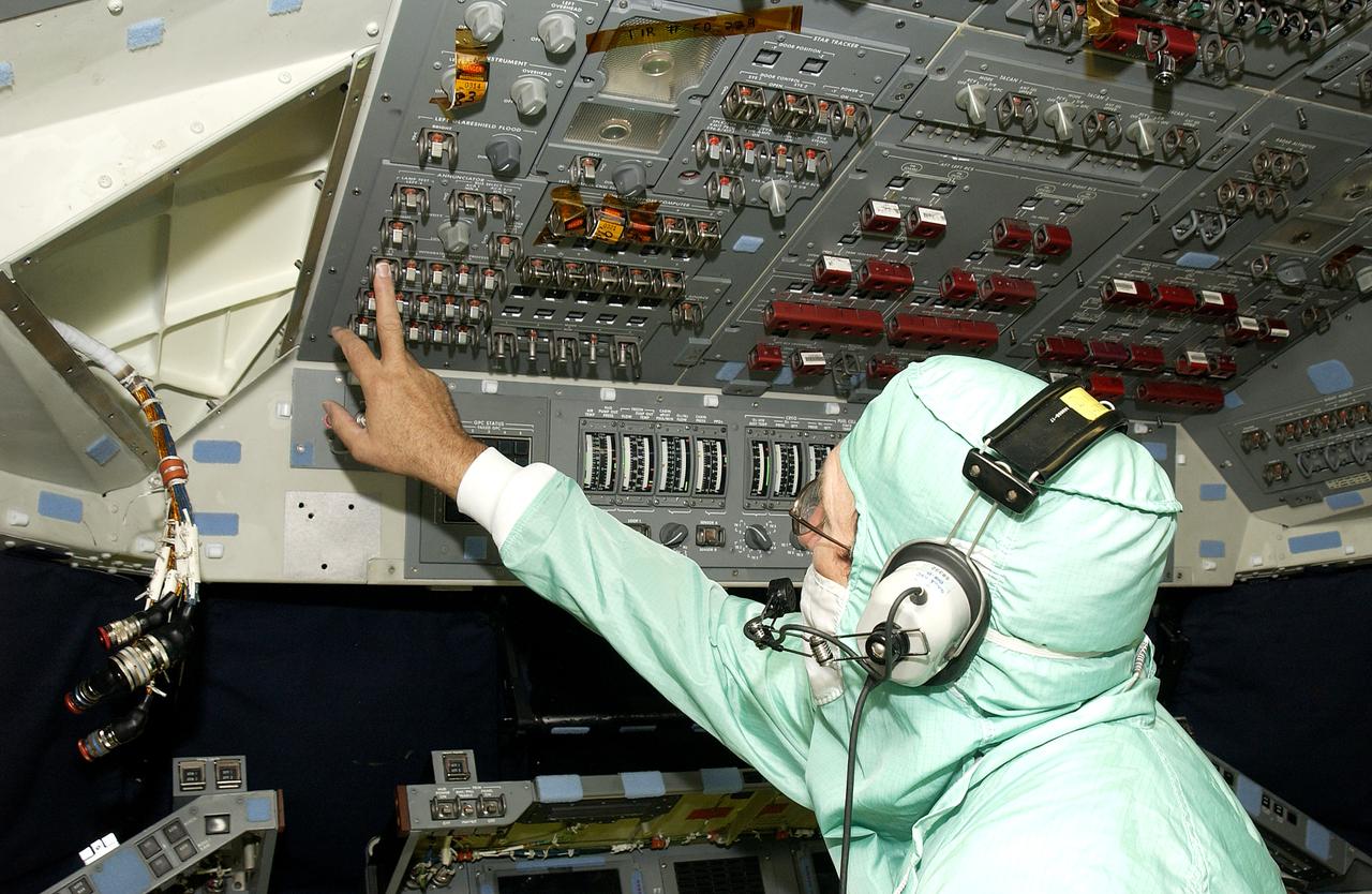 During power-up of the orbiter Discovery in the Orbiter Processing Facility, a technician moves a circuit reset on the cockpit console. Discovery has been undergoing Orbiter Major Modifications in the past year, ranging from wiring, control panels and black boxes to gaseous and fluid systems tubing and components. These systems were deserviced, disassembled, inspected, modified, reassembled, checked out and reserviced, as were most other systems onboard. The work includes the installation of the Multifunction Electronic Display Subsystem (MEDS) - a state-of-the-art “glass cockpit.”