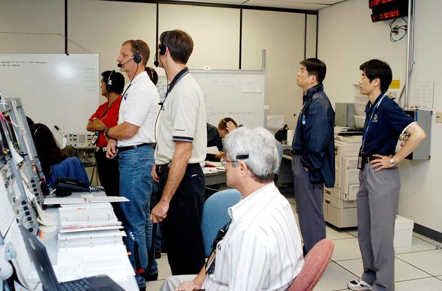 NASA image: KENNEDY SPACE CENTER, FLA. -  Japanese astronauts and other personnel in the Space Station Processing Facility observe sensors during a Multi-Equipment Interface Test (MEIT) on the Japanese Experiment Module (JEM).  The National Space Development Agency of Japan (NASDA) developed the laboratory at the Tsukuba Space Center near Tokyo. It is the first element, named "Kibo" (Hope), to be delivered to KSC. The JEM is Japan's primary contribution to the Station. It will enhance the unique research capabilities of the orbiting complex by providing an additional environment for astronauts to conduct science experiments.