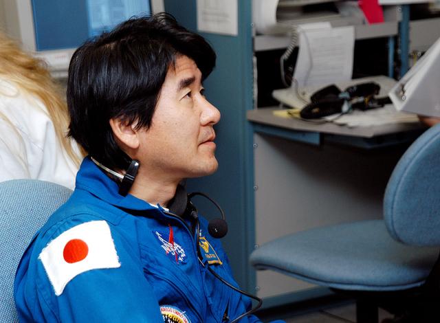 NASA image: KENNEDY SPACE CENTER, FLA. -  Takao Doi, an astronaut with the National Space Development Agency of Japan (NASDA), watches the sensors  during a Multi-Equipment Interface Test (MEIT) on the Japanese Experiment Module (JEM).  NASDA  developed the laboratory at the Tsukuba Space Center near Tokyo. It is the first element, named "Kibo" (Hope), to be delivered to KSC. The JEM is Japan's primary contribution to the Station. It will enhance the unique research capabilities of the orbiting complex by providing an additional environment for astronauts to conduct science experiments.