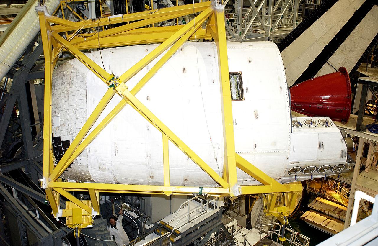 KENNEDY SPACE CENTER, FLA. -  In the Orbiter Processing Facility, an Orbital Maneuvering System (OMS) pod is removed from  the orbiter Atlantis during routine maintenance.