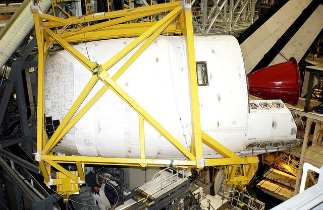 NASA image: KENNEDY SPACE CENTER, FLA. -  In the Orbiter Processing Facility, an Orbital Maneuvering System (OMS) pod is removed from  the orbiter Atlantis during routine maintenance.