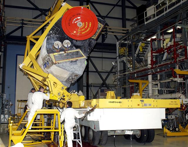 NASA image: KENNEDY SPACE CENTER, FLA. - In the Orbiter Processing Facility, an Orbital Maneuvering System (OMS) pod removed from  the orbiter Atlantis during routine maintenance.