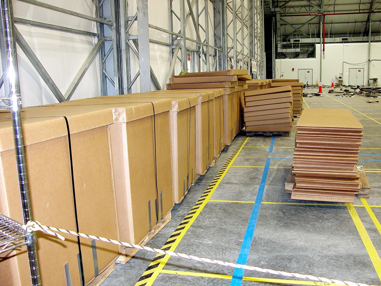 KENNEDY SPACE CENTER, FLA.  -  Storage boxes filled with Columbia debris (left) await transfer to storage in the Vehicle Assembly Building.  Empty boxes at right wait to be filled with more of the approximately 83,000 pieces shipped to KSC during search and recovery efforts in East Texas.