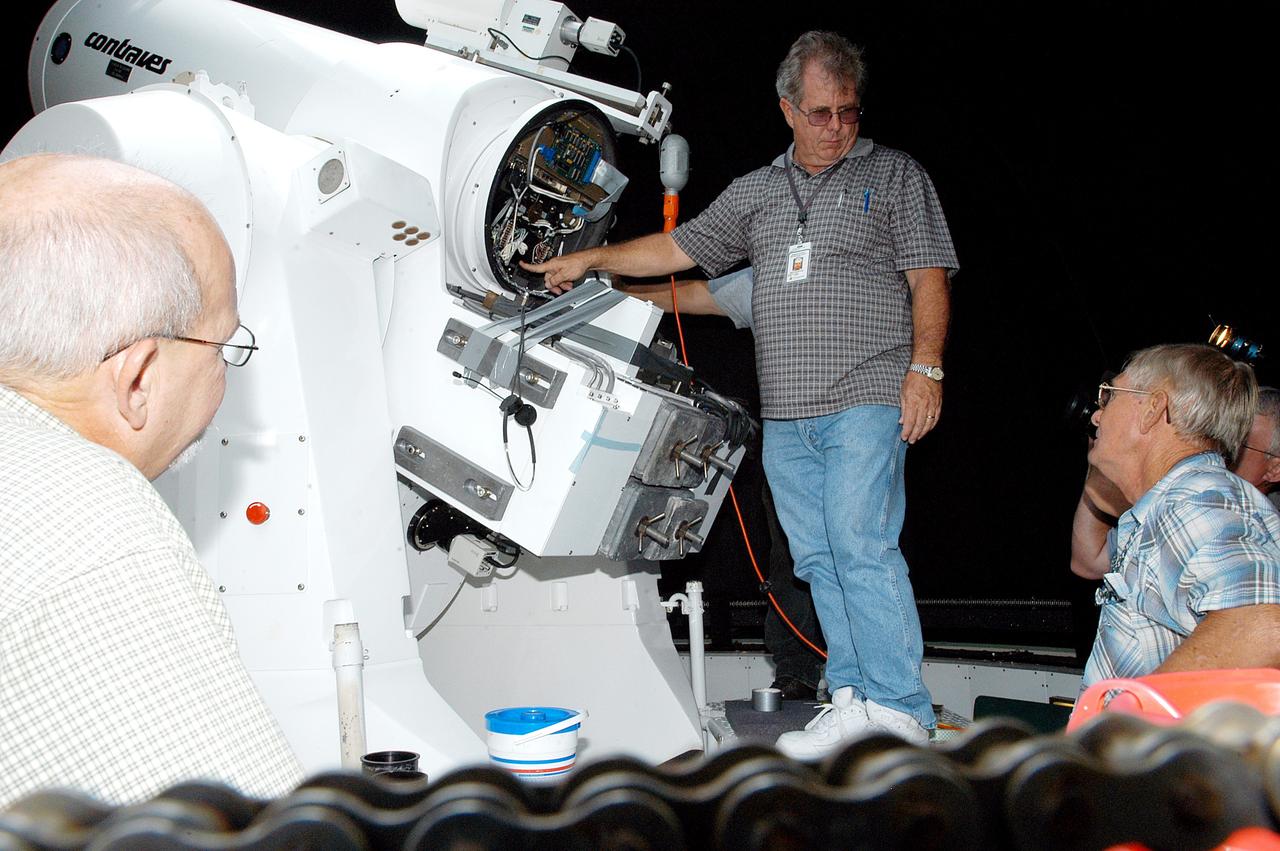 KENNEDY SPACE CENTER, FLA. -   Workers calibrate a tracking telescope, part of the Distant Object Attitude Measurement System (DOAMS),  located in Cocoa Beach, Fla.  The telescope provides optical support for launches from KSC and Cape Canaveral.