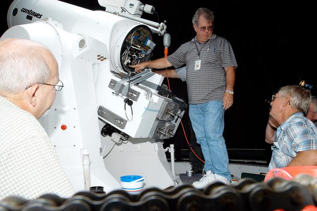 NASA image: KENNEDY SPACE CENTER, FLA. -   Workers calibrate a tracking telescope, part of the Distant Object Attitude Measurement System (DOAMS),  located in Cocoa Beach, Fla.  The telescope provides optical support for launches from KSC and Cape Canaveral.