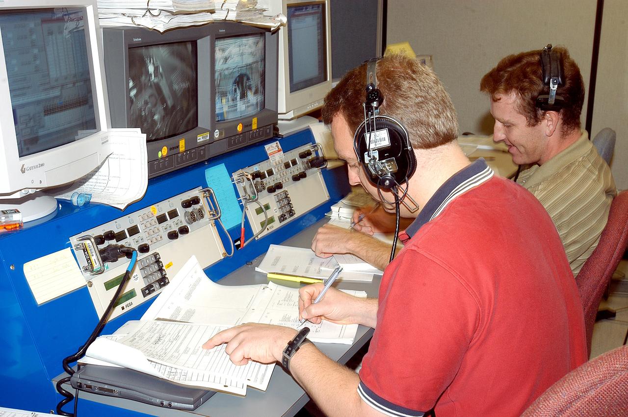 KENNEDY SPACE CENTER, FLA. -   Technicians in the Space Station Processing Facility work on a Multi-Element Integrated Test (MEIT) of the U.S. Node 2 and the Japanese Experiment Module (JEM).   Node 2 attaches to the end of the U.S. Lab on the ISS and provides attach locations for the Japanese laboratory, European laboratory, the Centrifuge Accommodation Module and, eventually, Multipurpose Logistics Modules. It will provide the primary docking location for the Shuttle when a pressurized mating adapter is attached to Node 2.  Installation of the module will complete the U.S. Core of the ISS.   The JEM, developed by the National Space Development Agency of Japan (NASDA), is Japan's primary contribution to the Station. It will enhance the unique research capabilities of the orbiting complex by providing an additional environment for astronauts to conduct science experiments.