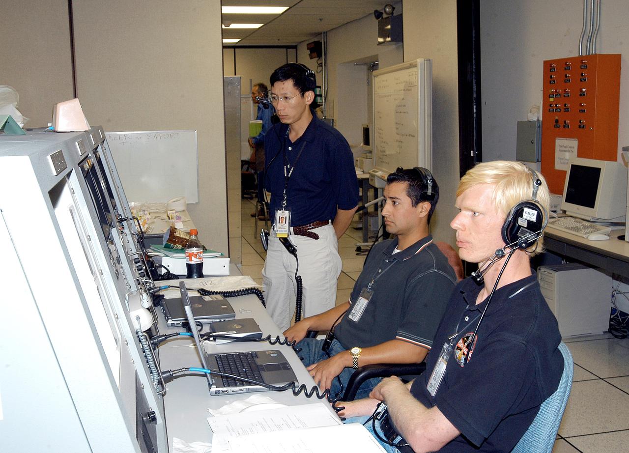 KENNEDY SPACE CENTER, FLA. -   Workers in the Space Station Processing Facility observe consoles during a Multi-Element Integrated Test (MEIT) of the U.S. Node 2 and the Japanese Experiment Module (JEM).   Node 2 attaches to the end of the U.S. Lab on the ISS and provides attach locations for the Japanese laboratory, European laboratory, the Centrifuge Accommodation Module and, eventually, Multipurpose Logistics Modules. It will provide the primary docking location for the Shuttle when a pressurized mating adapter is attached to Node 2.  Installation of the module will complete the U.S. Core of the ISS.   The JEM, developed by the National Space Development Agency of Japan (NASDA), is Japan's primary contribution to the Station. It will enhance the unique research capabilities of the orbiting complex by providing an additional environment for astronauts to conduct science experiments.
