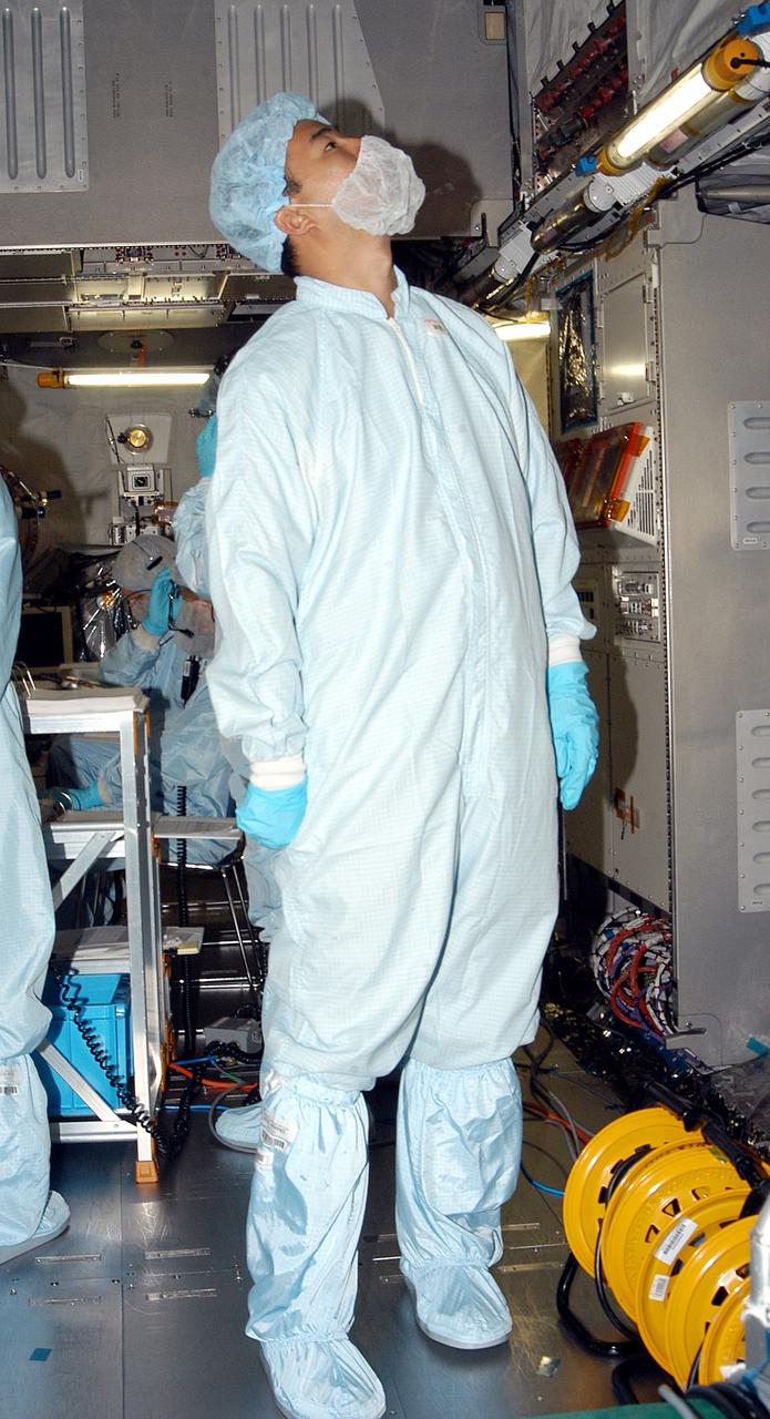 KENNEDY SPACE CENTER, FLA. -   Astronaut Soichi Noguchi, with the National Space Development Agency of Japan (NASDA), is inside the Japanese Experiment Module (JEM), undergoing a Multi-Element Integrated Test (MEIT)  in the Space Station Processing Facility.  Noguchi is assigned to mission STS-114 as a mission specialist.   Node 2 attaches to the end of the U.S. Lab on the ISS and provides attach locations for the Japanese laboratory, European laboratory, the Centrifuge Accommodation Module and, eventually, Multipurpose Logistics Modules. It will provide the primary docking location for the Shuttle when a pressurized mating adapter is attached to Node 2.  Installation of the module will complete the U.S. Core of the ISS.   The JEM, developed by NASDA,  is Japan's primary contribution to the Station. It will enhance the unique research capabilities of the orbiting complex by providing an additional environment for astronauts to conduct science experiments.