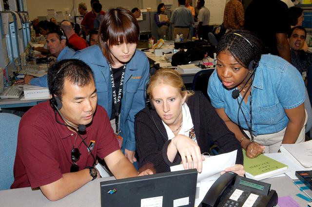 NASA image: KENNEDY SPACE CENTER, FLA. -  Astronaut Soichi Noguchi (left), with the National Space Development Agency of Japan (NASDA), points to data on the console during a Multi-Element Integrated Test (MEIT) of the U.S. Node 2 and the Japanese Experiment Module (JEM) in the Space Station Processing Facility.  The JEM, developed by NASDA, is Japan's primary contribution to the Station. It will enhance the unique research capabilities of the orbiting complex by providing an additional environment for astronauts to conduct science experiments. Noguchi is assigned to mission STS-114 as a mission specialist.  Node 2 provides attach locations for the Japanese laboratory, as well as European laboratory, the Centrifuge Accommodation Module and, eventually, Multipurpose Logistics Modules.  Installation of the module will complete the U.S. Core of the ISS.