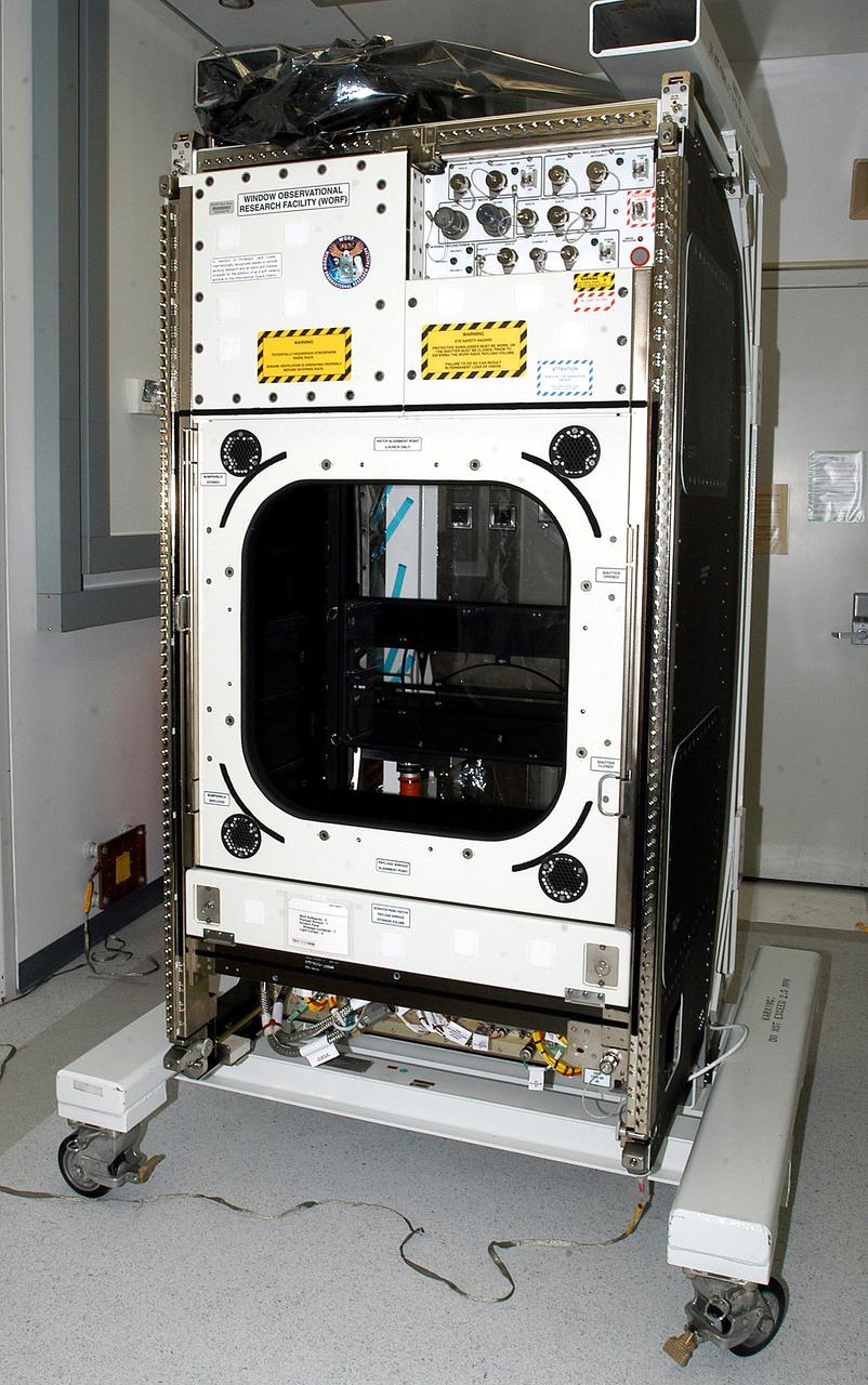 KENNEDY SPACE CENTER, FLA. -  The Window Observational Research Facility (WORF), seen in the Space Station Processing Facility, was designed and built by the Boeing Co. at NASA’s Marshall Space Flight Center in Huntsville, Ala.   WORF will be delivered to the International Space Station and placed in the rack position in front of the Destiny lab window,  providing locations for attaching cameras, multi-spectral scanners and other instruments. WORF will support a variety of scientific and commercial experiments in areas of Earth systems and processes, global ecological changes in Earth’s biosphere, lithosphere, hydrosphere and climate system, Earth resources, natural hazards, and education.  After installation, it will become a permanent focal point for Earth Science research aboard the space station.