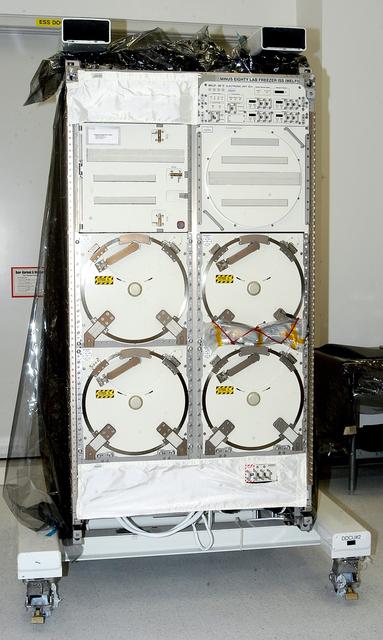 NASA image: KENNEDY SPACE CENTER, FLA. -  The Minus Eighty Lab Freezer for ISS (MELFI), provided as Laboratory Support Equipment by the European Space Agency for the International Space Station, is seen in the Space Station Processing Facility.  The lab will provide cooling and storage for reagents, samples and perishable materials in four insulated containers called dewars with independently selectable temperatures of -80°C, -26°C, and +4°C. It also will be used to transport samples to and from the station.   The MELFI is planned for launch on the ULF-1 mission.