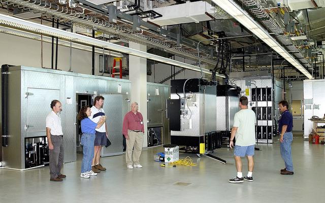 NASA image: KENNEDY SPACE CENTER, FLA. -  Employees check out the new chamber facilities of the Space Life Sciences Lab (SLSL), formerly known as the Space Experiment Research and Processing Laboratory (SERPL).  From left are Ray Wheeler, with NASA; Debbie Wells and Larry Burns, with Dynamac; A.O. Rule, president of Environmental Growth Chambers, Inc. (ECG); Neil Yorio, with Dynamac; and John Wiezchowski, with ECG.  The SLSL is a state-of-the-art facility being built for ISS biotechnology research. Developed as a partnership between NASA-KSC and the State of Florida, NASA’s life sciences contractor will be the primary tenant of the facility, leasing space to conduct flight experiment processing and NASA-sponsored research. About 20 percent of the facility will be available for use by Florida’s university researchers through the Florida Space Research Institute.