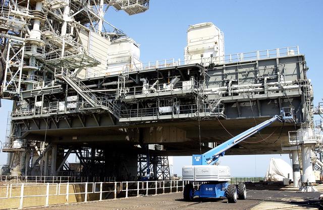 NASA image: KENNEDY SPACE CENTER, FLA. - Sandblasting begins on the Mobile Launcher Platform on Launch Pad 39A to remove corrosion before repainting.  Routine maintenance includes sandblasting and repainting as preventive means to minimize corrosion.