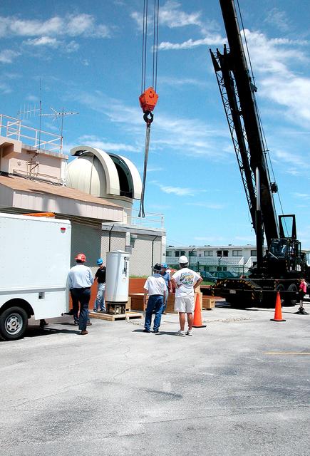 NASA image: KENNEDY SPACE CENTER, FLA. -  In Cocoa Beach, Fla., a new five-meter telescope sits on a pallet waiting to be lifted up to the dome above and installed.  The tracking telescope is part of the Distant Object Attitude Measurement System (DOAMS) that provides optical support for launches from KSC and Cape Canaveral.