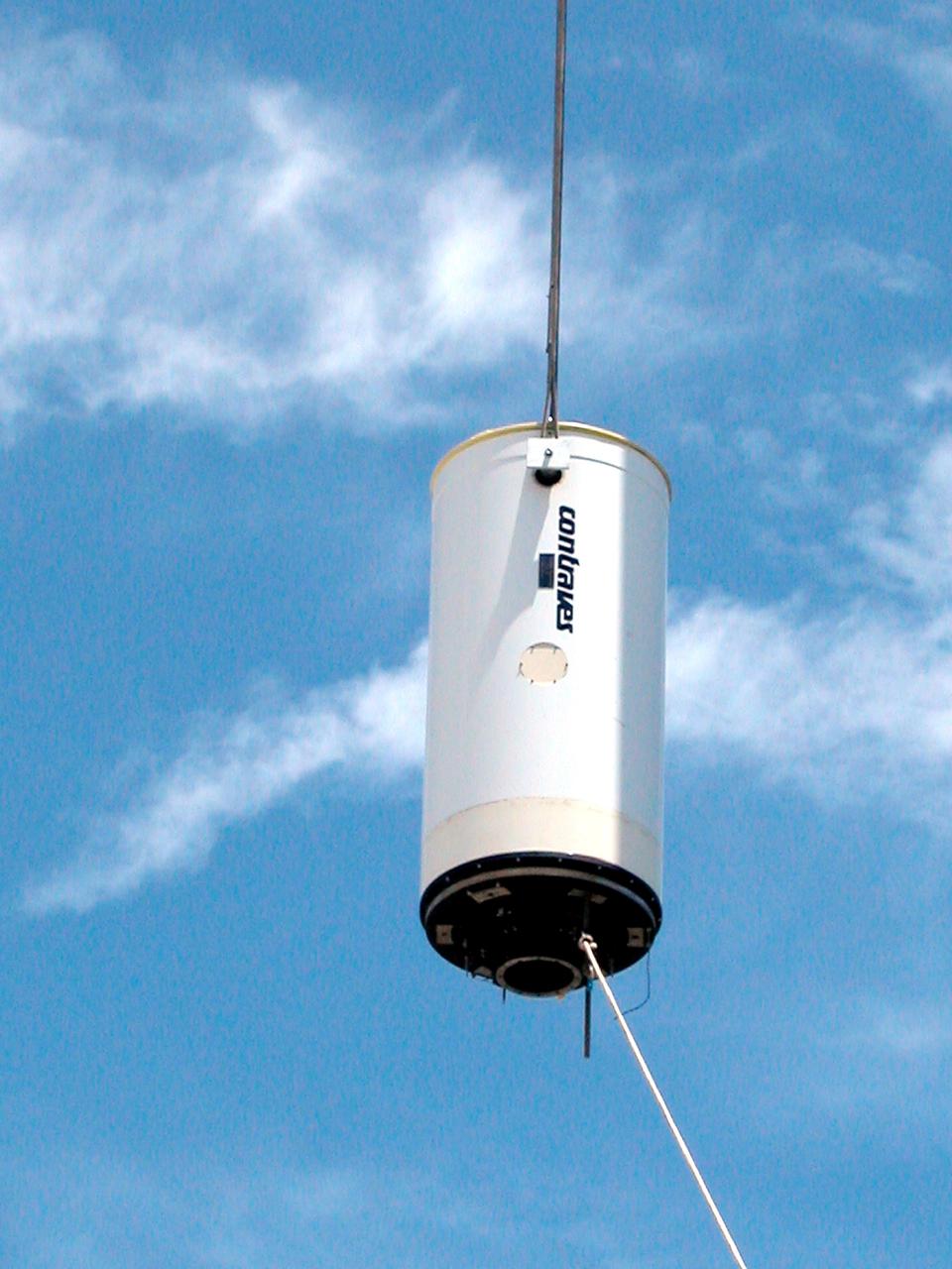 KENNEDY SPACE CENTER, FLA. - In Cocoa Beach, Fla., a new five-meter telescope is lifted up to the dome for installation.  The tracking telescope is part of the Distant Object Attitude Measurement System (DOAMS) that provides optical support for launches from KSC and Cape Canaveral.