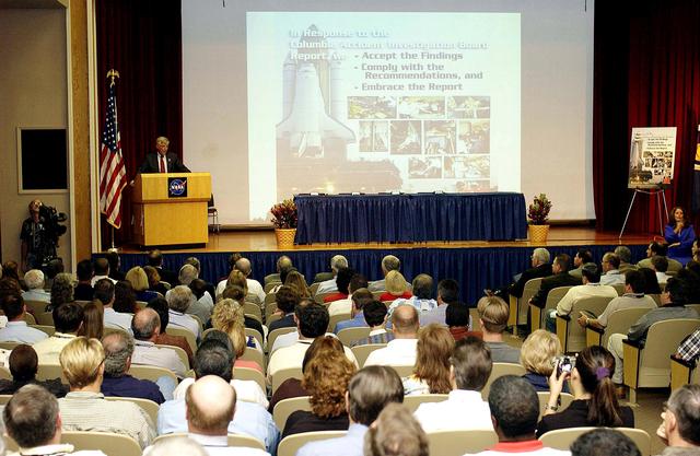 NASA image: KENNEDY SPACE CENTER, FLA. -  Center Director Jim Kennedy talks to employees during his first all-hands meeting. Making presentations were Dr. Woodrow Whitlow Jr., KSC deputy director; Tim Wilson, assistant chief engineer for Shuttle; and Bill Pickavance, vice president and deputy program manager, Florida operations, United Space Alliance.  Representatives from the Shuttle program and contractor team were on hand to discuss the Columbia Accident Investigation Board report and where KSC stands in its progress toward return to flight.