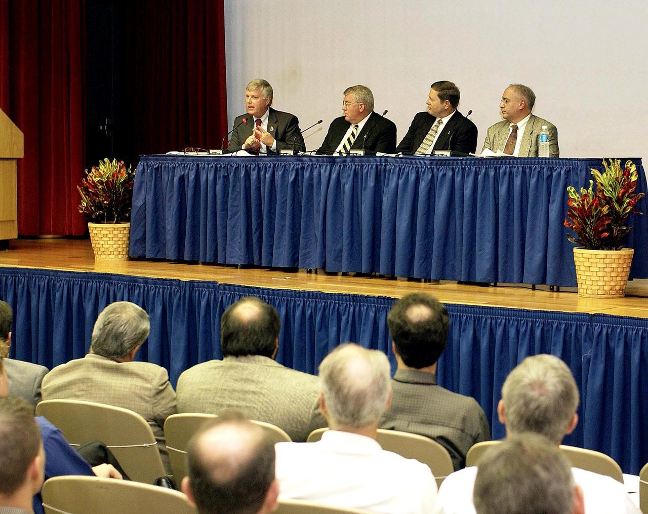 KENNEDY SPACE CENTER, FLA. -  Representatives from the Shuttle program and contractor team are part of Center Director Jim Kennedy’s first all-hands meeting for employees. From left are Kennedy, Bill Pickavance, Mike Wetmore and Bert Garrido.   They were on hand to discuss the Columbia Accident Investigation Board report and where KSC stands in its progress toward return to flight.