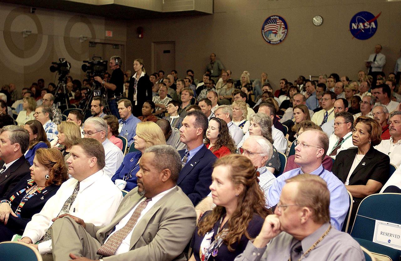 KENNEDY SPACE CENTER, FLA. -  Employees in the Training Auditorium listen to  Center Director Jim Kennedy’s first all-hands meeting for employees.  Making presentations were Dr. Woodrow Whitlow Jr., KSC deputy director; Tim Wilson, assistant chief engineer for Shuttle; and Bill Pickavance, vice president and deputy program manager, Florida operations, United Space Alliance.  Representatives from the Shuttle program and contractor team were on hand to discuss the Columbia Accident Investigation Board report and where KSC stands in its progress toward return to flight.