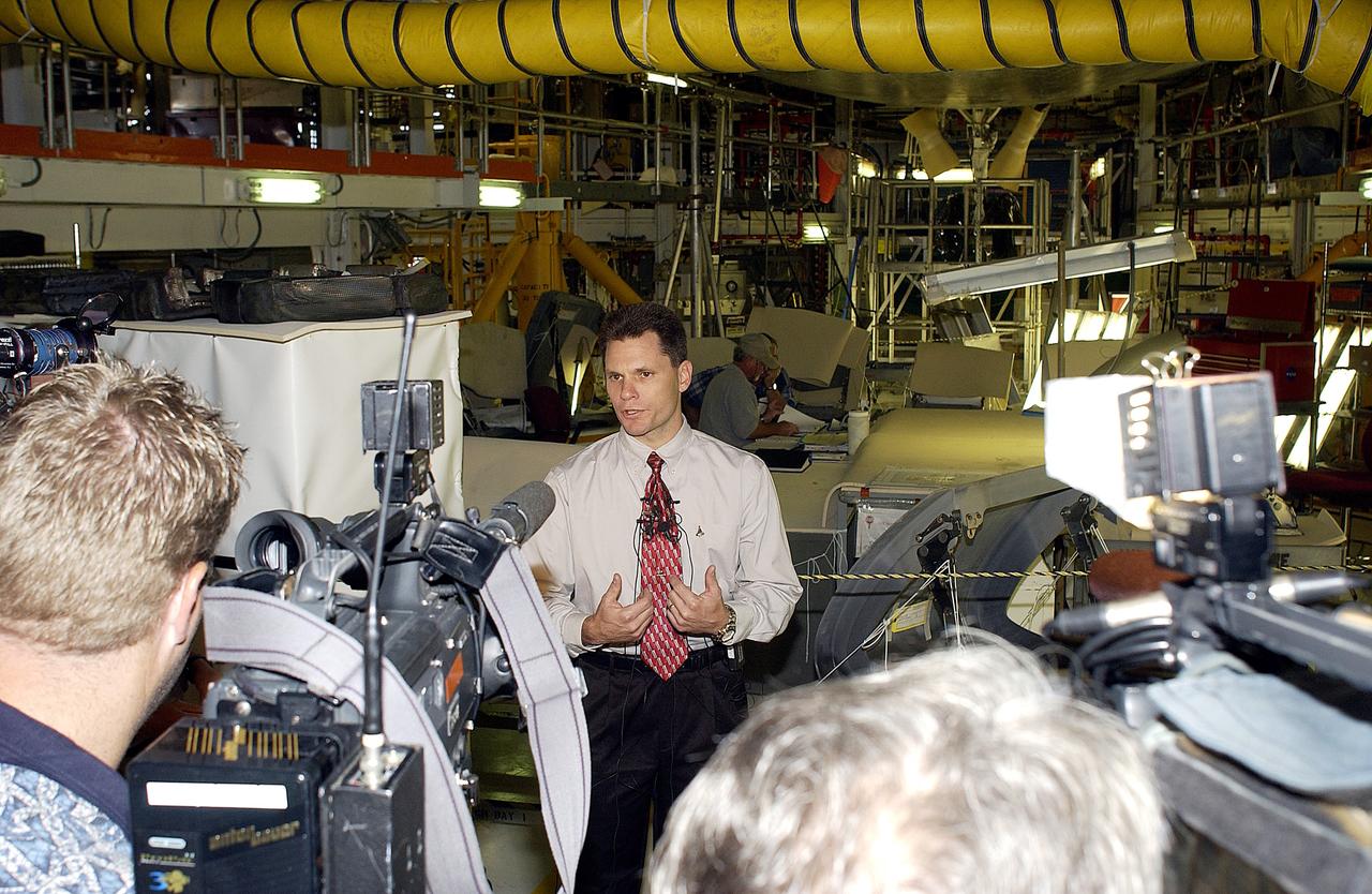 KENNEDY SPACE CENTER, FLA. -   NASA Vehicle Manager Scott Thurston talks to the media in the Orbiter Processing Facility.  The media was invited to see the orbiter Atlantis as it is being prepared for Return to Flight.  Both local and national reporters representing print and TV networks were able to see work in progress on Atlantis, including the reinstallation of the Reinforced Carbon-Carbon panels on the orbiter’s wing leading edge; wiring inspections; and checks of the engines in the Orbital Maneuvering System.