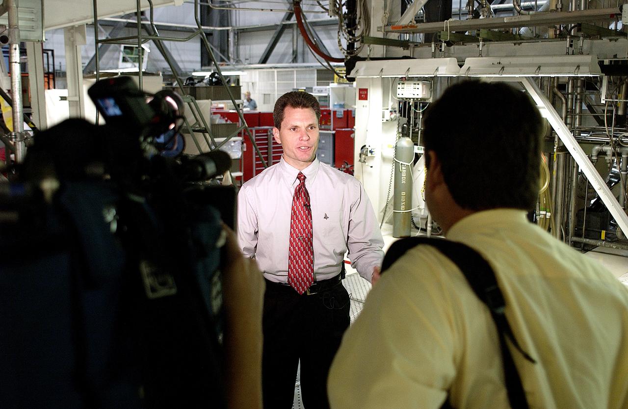 KENNEDY SPACE CENTER, FLA. -  NASA Vehicle Manager Scott Thurston talks to the media in the Orbiter Processing Facility.  The media was invited to see the orbiter Atlantis as it is being prepared for Return to Flight.  Both local and national reporters representing print and TV networks were able to see work in progress on Atlantis, including the reinstallation of the Reinforced Carbon-Carbon panels on the orbiter’s wing leading edge; wiring inspections; and checks of the engines in the Orbital Maneuvering System.