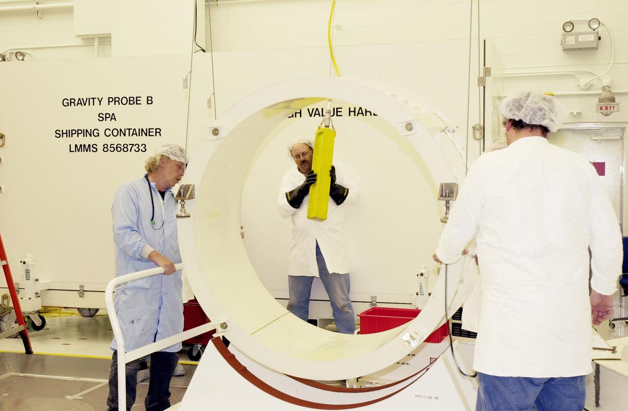 Workers in the spacecraft processing facility on North Vandenberg Air Force Base get ready to begin processing the Gravity Probe B experiment, including setting up mechanical and electrical ground support equipment, making necessary connections and conditioning the spacecraft battery. The Gravity Probe B will launch a payload of four gyroscopes into low-Earth polar orbit to test two extraordinary predictions of Albert Einstein’s general theory of relativity: the geodetic effect (how space and time are warped by the presence of the Earth) and frame dragging (how Earth’s rotation drags space and time around with it). Once in orbit, for 18 months each gyroscope’s spin axis will be monitored as it travels through local spacetime, observing and measuring these effects. The experiment was developed by Stanford University, Lockheed Martin and NASA’s Marshall Space Flight Center.