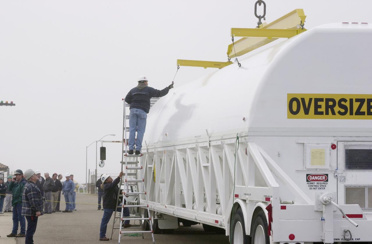 VANDENBERG AFB, CALIF. -   Enclosed in a canister, the Gravity Probe B (GP-B) spacecraft arrives at the spacecraft processing facility on North Vandenberg Air Force Base .  Gravity Probe B will launch a payload of four gyroscopes into low-Earth polar orbit to test two extraordinary predictions of Albert Einstein’s general theory of relativity: the geodetic effect (how space and time are warped by the presence of the Earth) and frame dragging (how Earth’s rotation drags space and time around with it). Once in orbit, for 18 months each gyroscope’s spin axis will be monitored as it travels through local spacetime, observing and measuring these effects.  The experiment was developed by Stanford University, Lockheed Martin and NASA’s Marshall Space Flight Center.