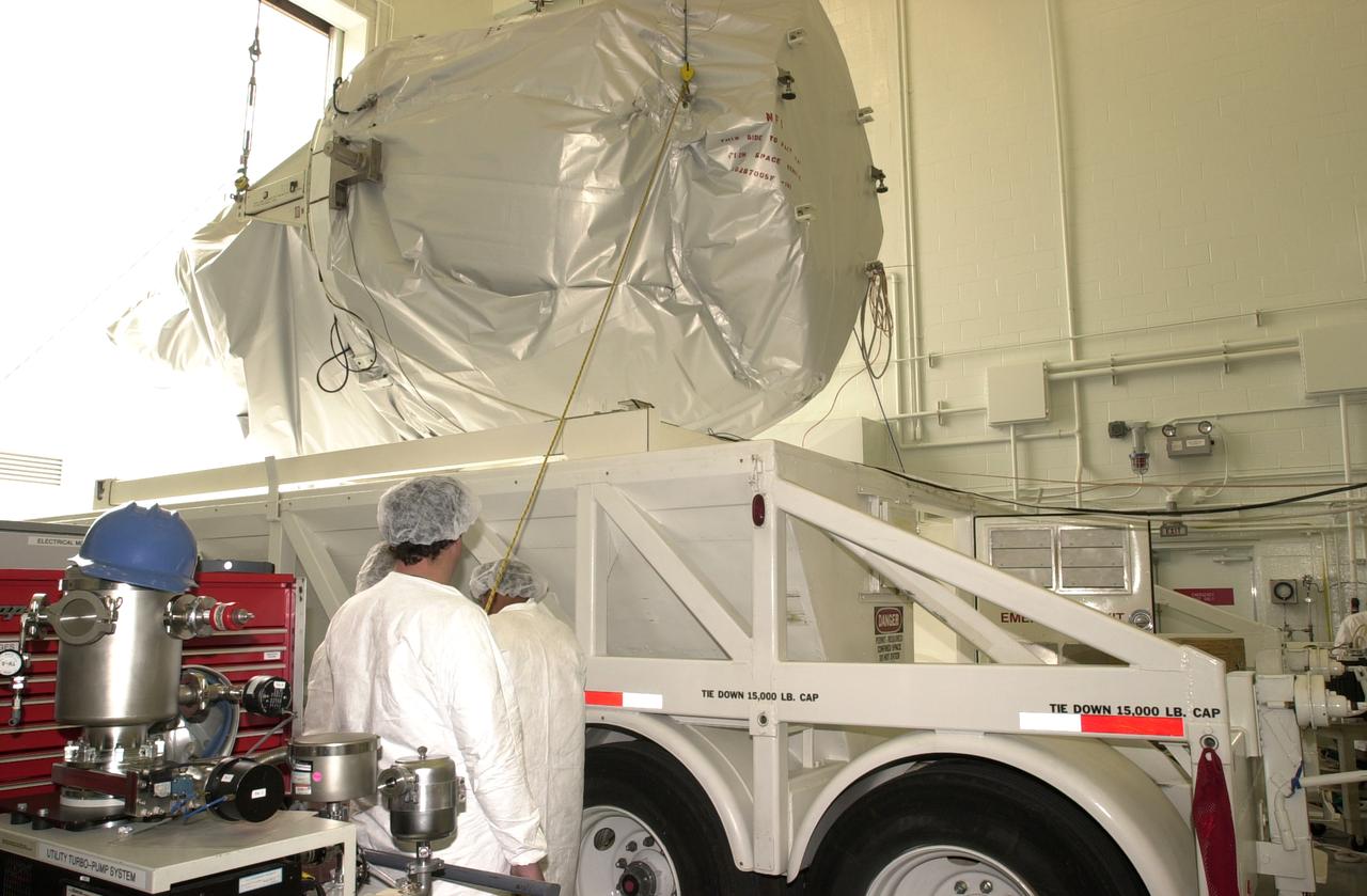 The Gravity Probe B experiment enters the spacecraft processing facility on North Vandenberg Air Force Base. Gravity Probe B will launch a payload of four gyroscopes into low-Earth polar orbit to test two extraordinary predictions of Albert Einstein’s general theory of relativity: the geodetic effect (how space and time are warped by the presence of the Earth) and frame dragging (how Earth’s rotation drags space and time around with it). Once in orbit, for 18 months each gyroscope’s spin axis will be monitored as it travels through local spacetime, observing and measuring these effects. The experiment was developed by Stanford University, Lockheed Martin and NASA’s Marshall Space Flight Center.