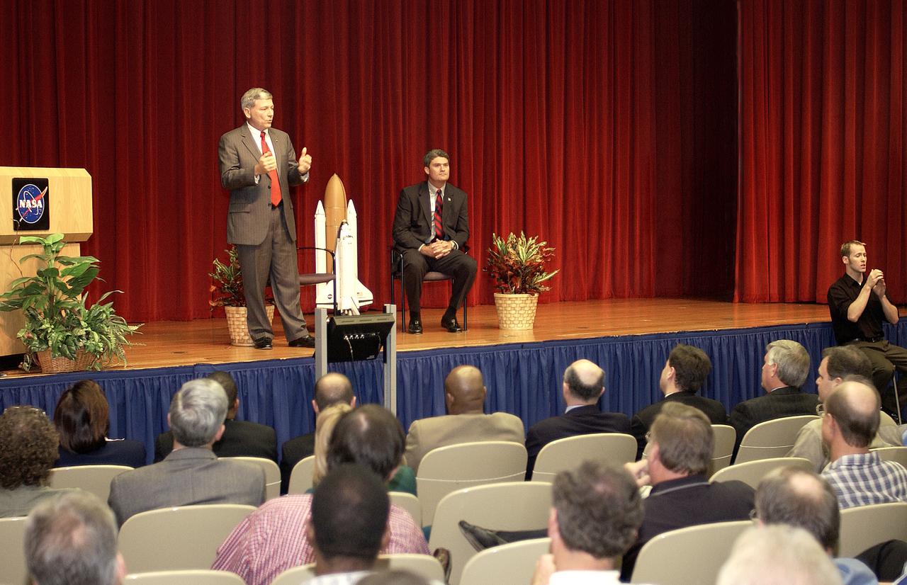 Mike Kostelnik, deputy associate administrator, Space Shuttle and International Space Station Programs, addresses the group of employees gathered for an all-hands briefing in the Training Auditorium. At right is Bill Parsons, Shuttle Program manager; not seen is Center Director Jim Kennedy. Topics discussed were return to flight and the Shuttle program.