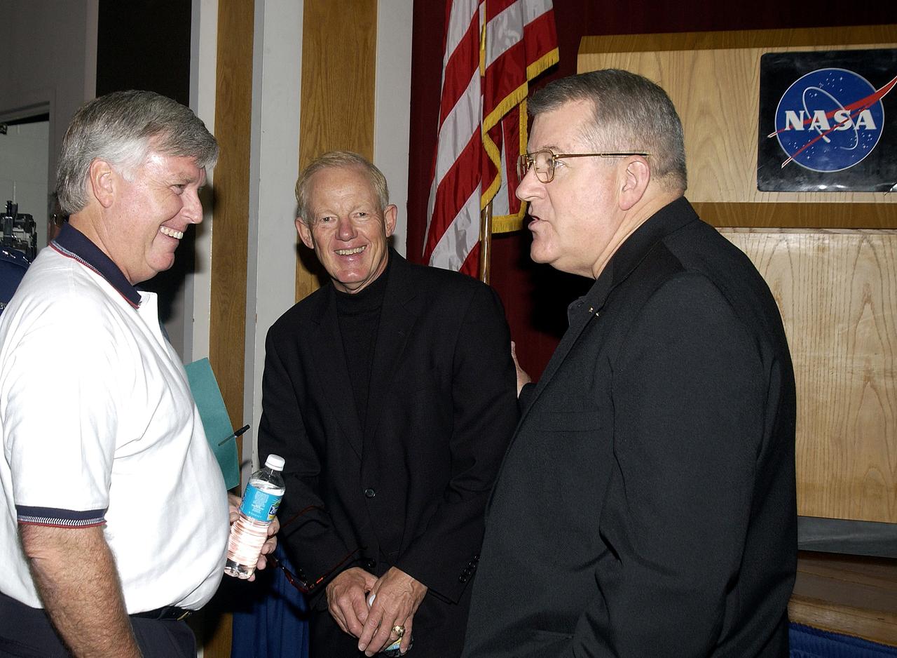 KENNEDY SPACE CENTER, FLA. -  Before the start of the kickoff presentation for Spaceport Super Safety and Health Day, Center Director Jim Kennedy (left) chats with guest speaker Capt. Charles Plumb (USNR retired) and United Space Alliance Vice President and Deputy Program Manager, Florida Operations, Bill Pickavance. Spaceport Super Safety and Health Day is an annual event at KSC and Cape Canaveral Air Force Station dedicated to reinforcing safe and healthful behaviors in the workforce.  Safety Awards were also given to individuals and groups.